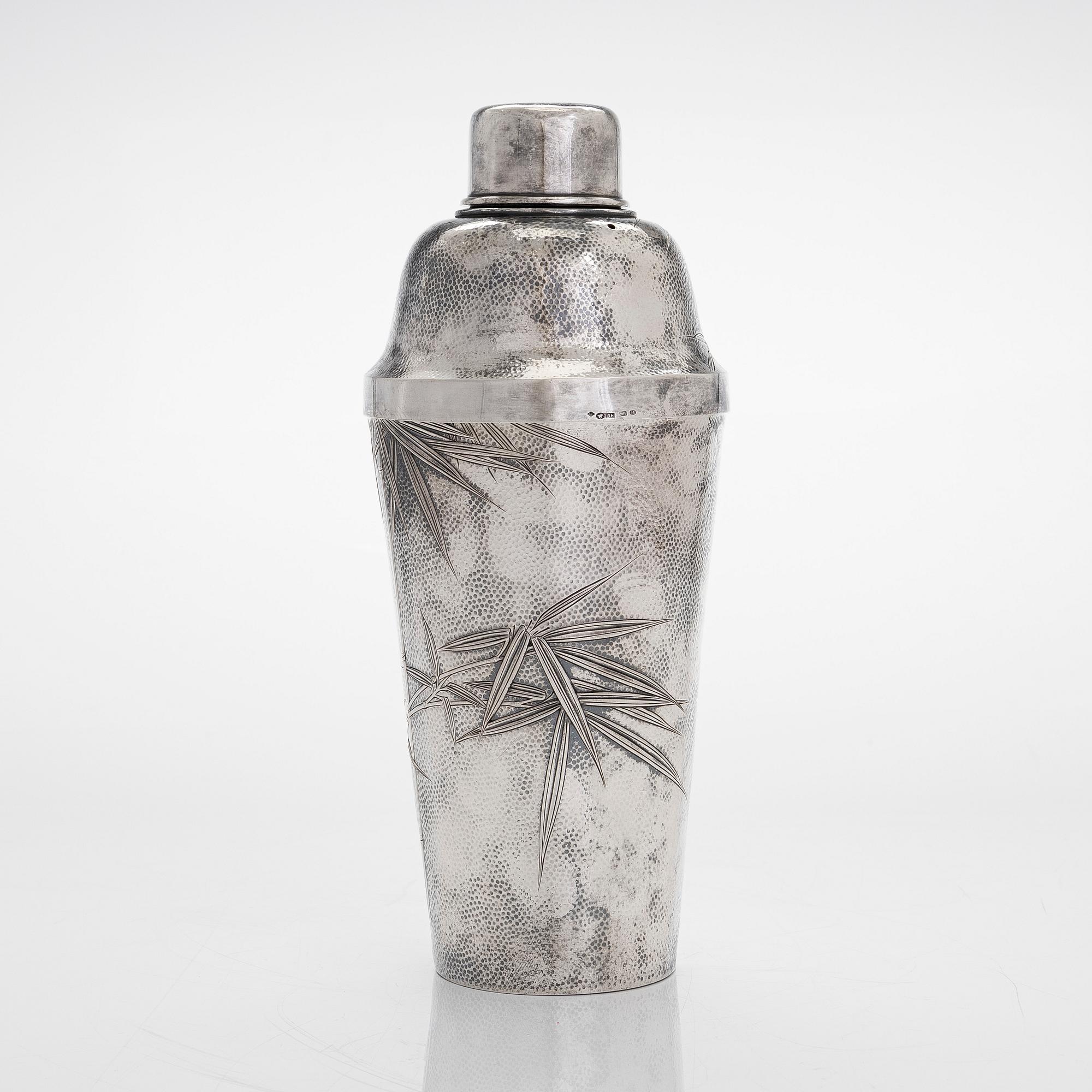 A silver cocktail shaker with strainer, Japan, first half of the 20th century.