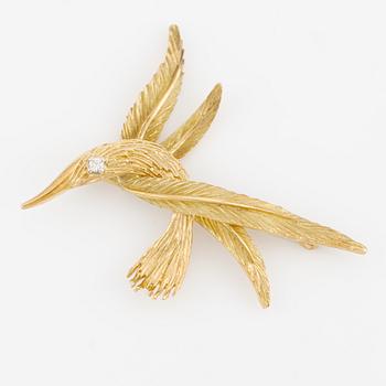 A bird brooch 18K gold with a round brilliant-cut diamond.