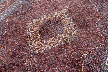 An oriental carpet, c. 371 x 264 cm.