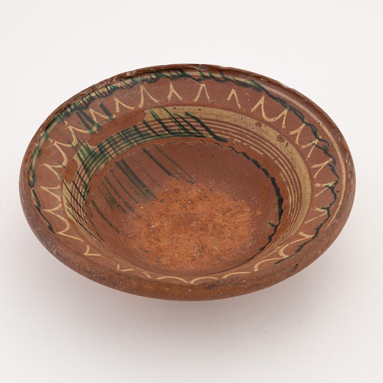 Two clay Swedish folk art dishes, 19th Century.