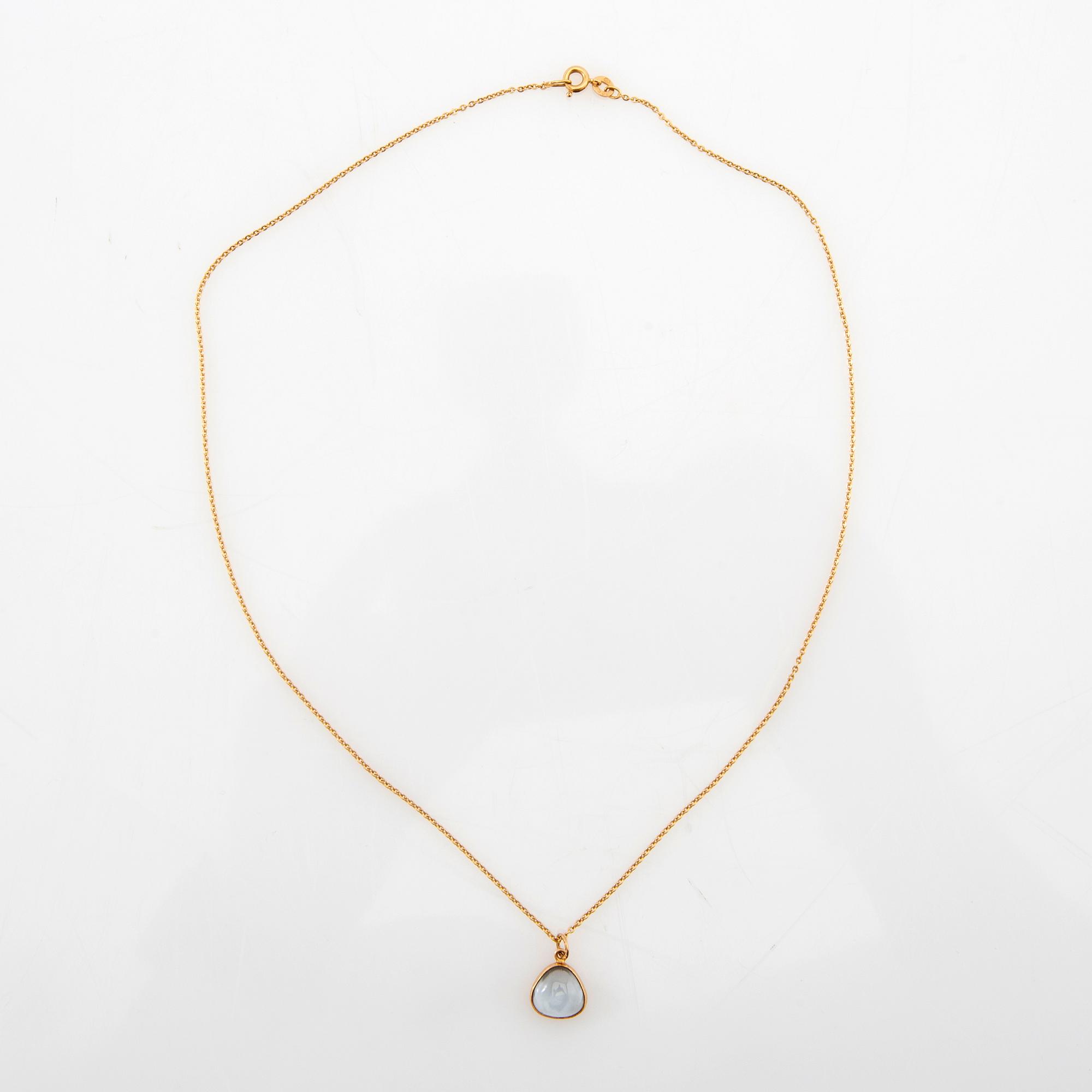 Halsband 18K guld med cabochonslipat blått glas.
