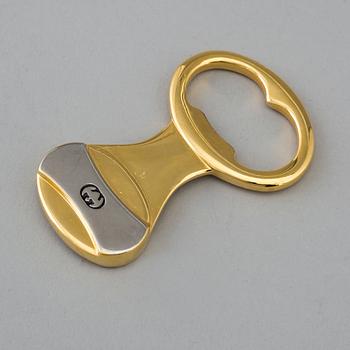 GUCCI, bottle opener.