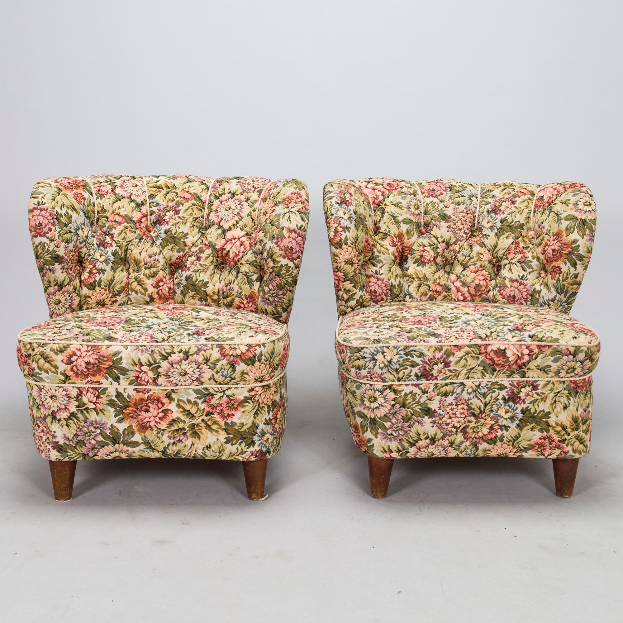 A pair of mid-20th-century armchairs.