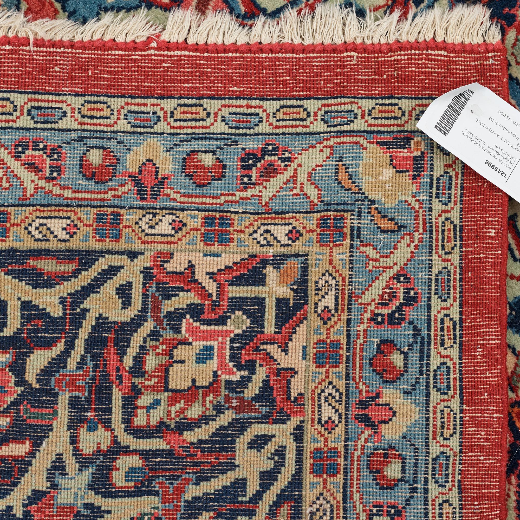 A carpet, a semi-antique/an old Persian, probably a Qazvin, ca 345-349 x 251,5-253 cm.