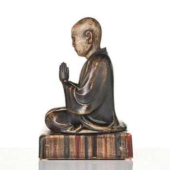 A painted and lacquered wooden sculpture of a monk, Japan, 19th century.