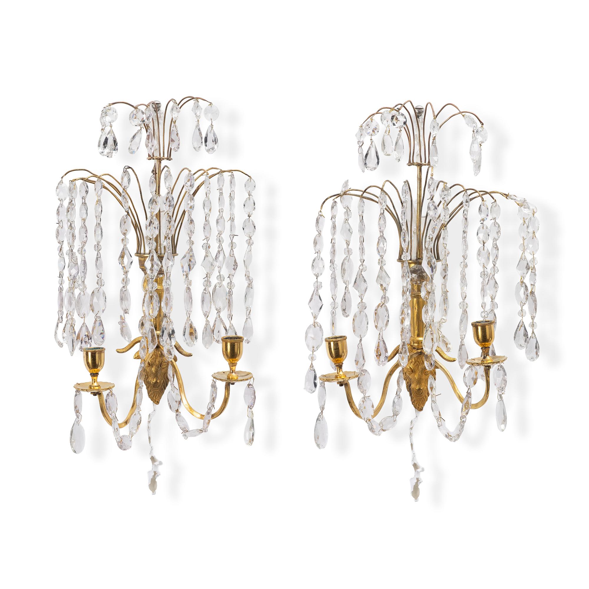 A pair of late Gustavian ormolu two-branch lustres, circa 1800.