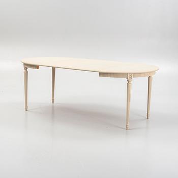 A Gustavian style dining table and eight chairs, late 20th Century.