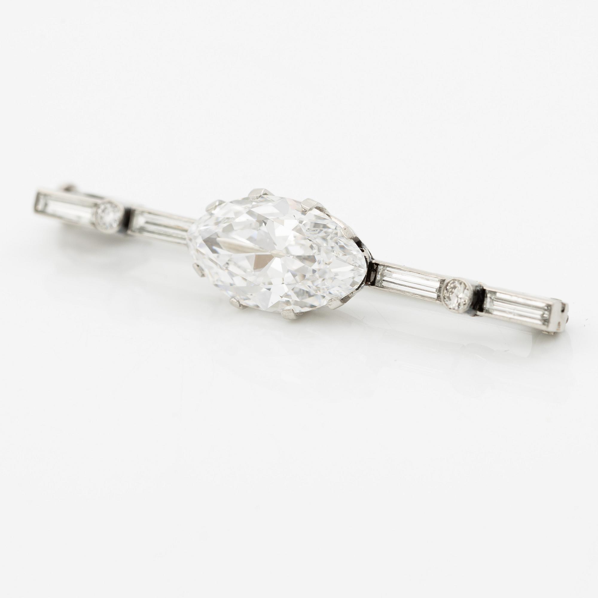 A brooch in platinum with an old-cut navette-shaped diamond ca 3.65 ct.