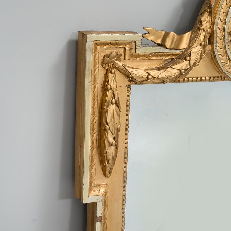 A gustavian mirror by Per Westin, signed PW and with the Stockholm hallmark 1777.