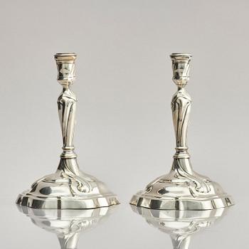 A pair of German silver Rococo candlesticks, marks of Johann Jacob Baur, Augsburg 1777-1779.