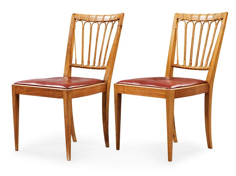 A pair of Josef Frank walnut and rattan chairs, Svenskt Tenn, model 1165.