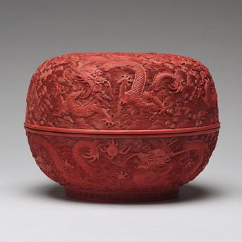 A carved red dragon box with cover, Qing dynasty (1662-1912).