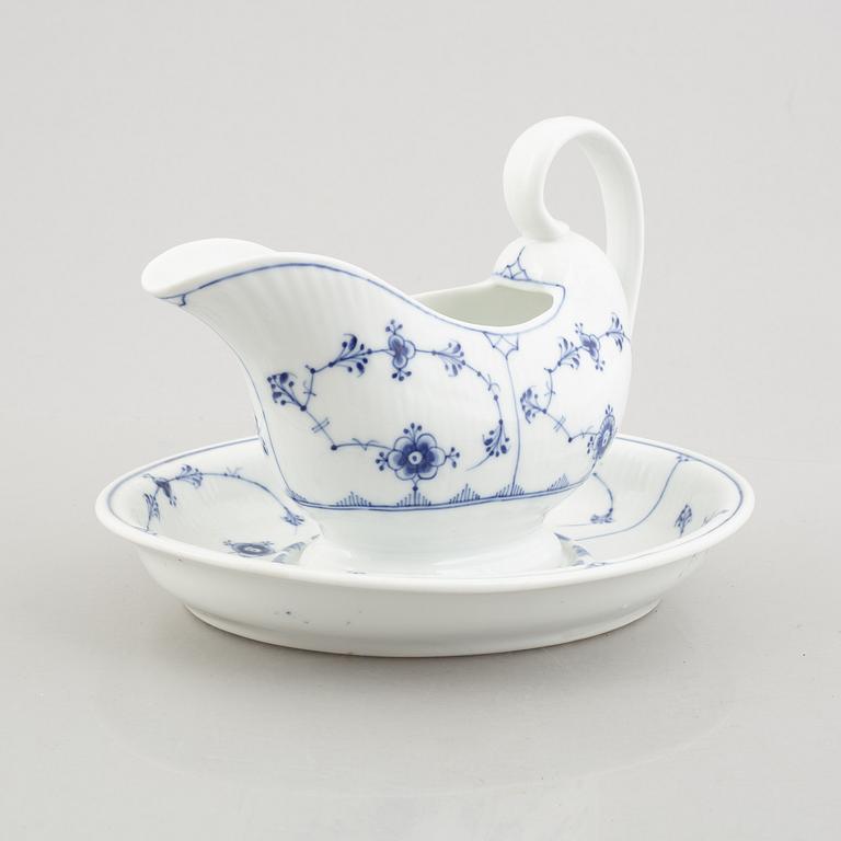 A 'Blue Fluted' / 'Musselmalet' porcelain sauce boat with stand, Royal Copenhagen, model 407, 1893-1900 and 19th century.