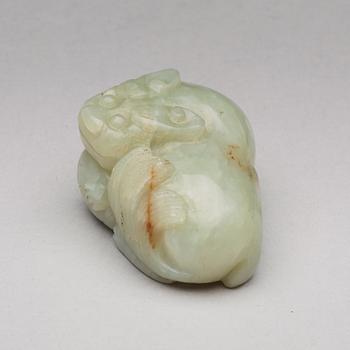 A nephrite figure of a reclining mythical beast, late Qing dynasty.