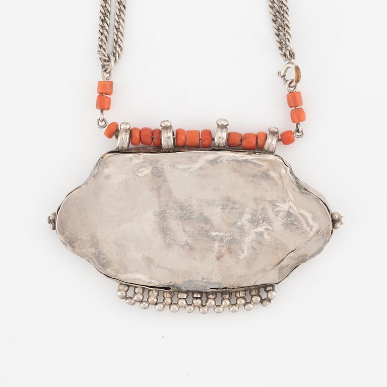 Silver and coral necklace.