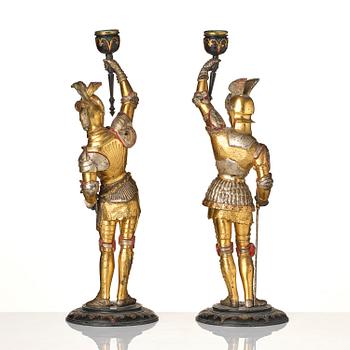 A pair of presumably German knights candlesticks, secound half 19th century.