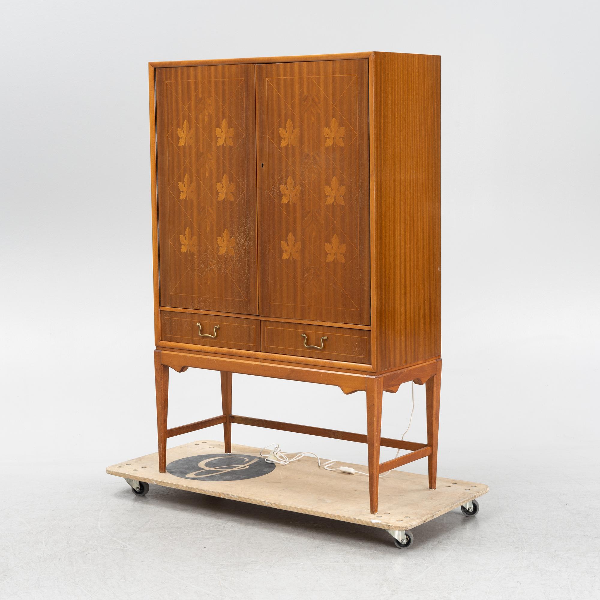 A Swedsih Modern mahogany veneered drinks cabinet, 1940s/50s.