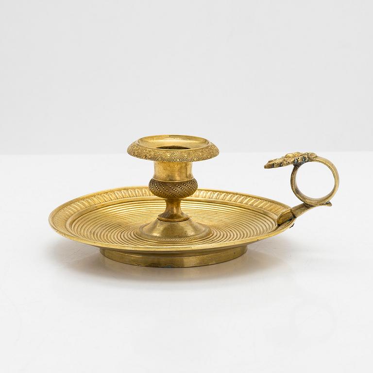 A 19th century Empire style chamberstick.