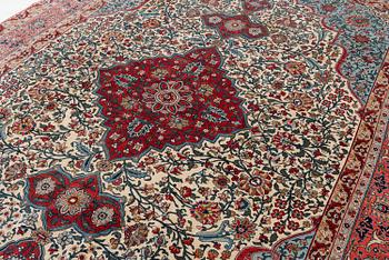 A semi-antique Qum carpet. Central Persia, c. 345 x 258 cm.