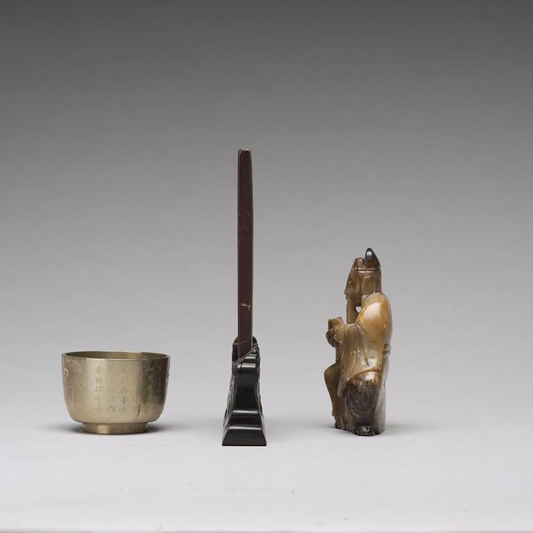 A stone placque, a soapstone figure and a cup, late Qing dynasty.