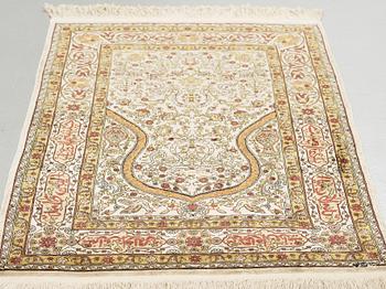 A silk Hereke possibly, around 96 x 66 cm.