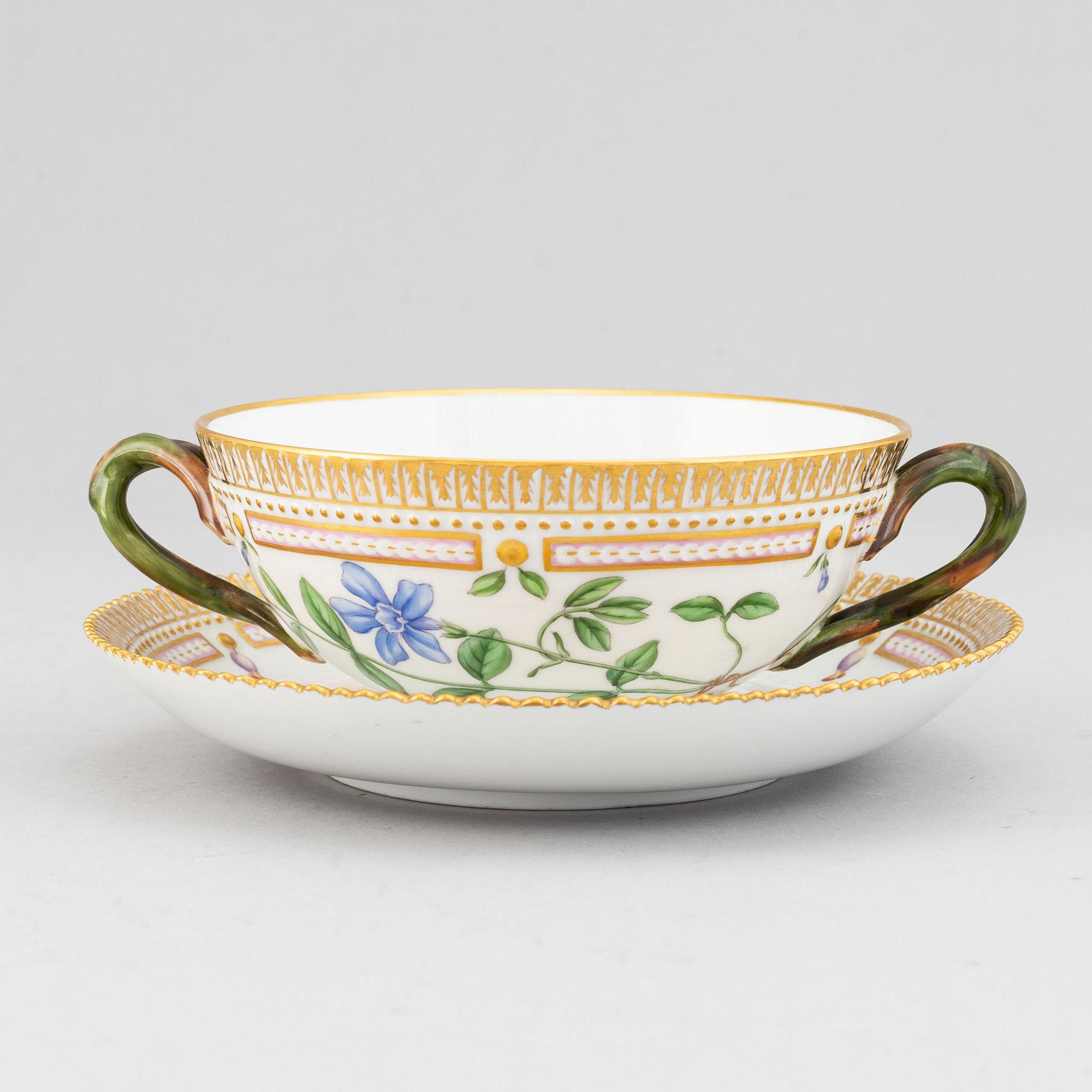 Royal Copenhagen, A 'Flora Danica' porcelain soup cup with saucer.
