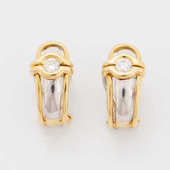 A pair of 18K gold earrings.