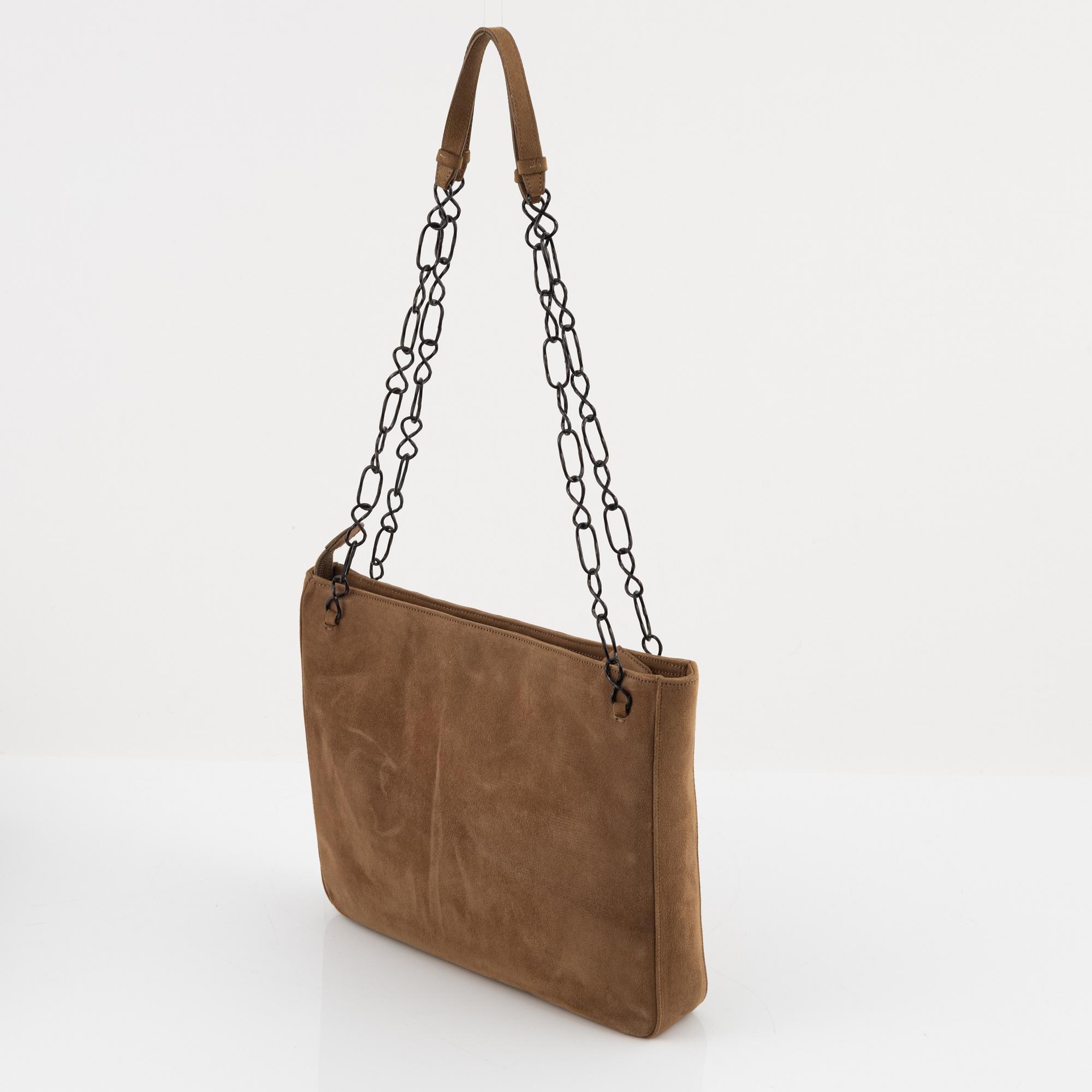 Prada, a tan suede bag.