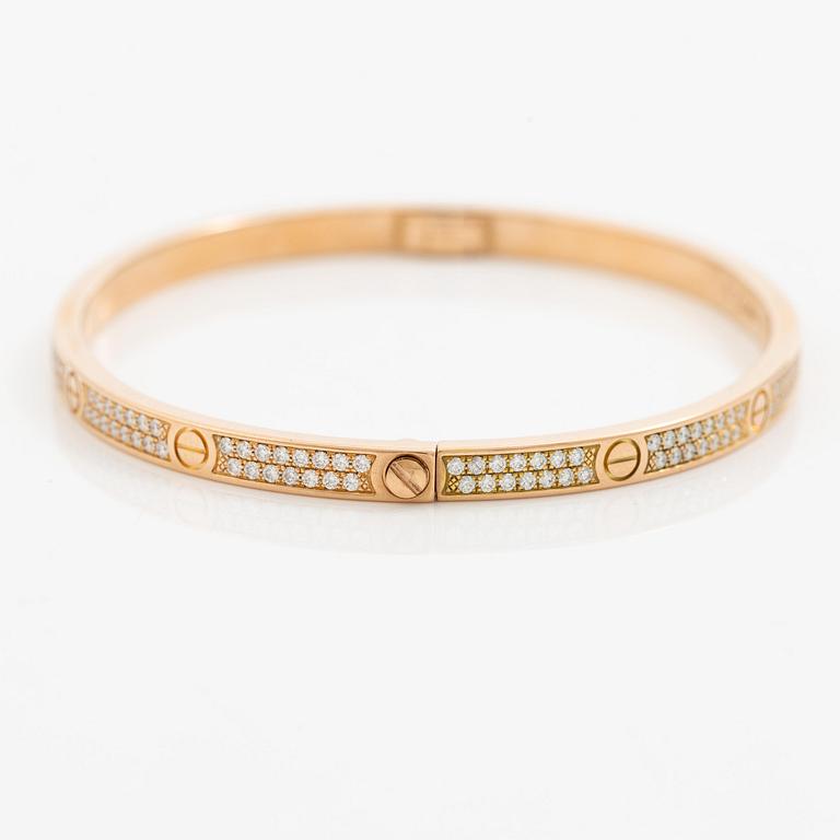 A Cartier bangle "Love" 18K rose gold with round brilliant-cut diamonds.