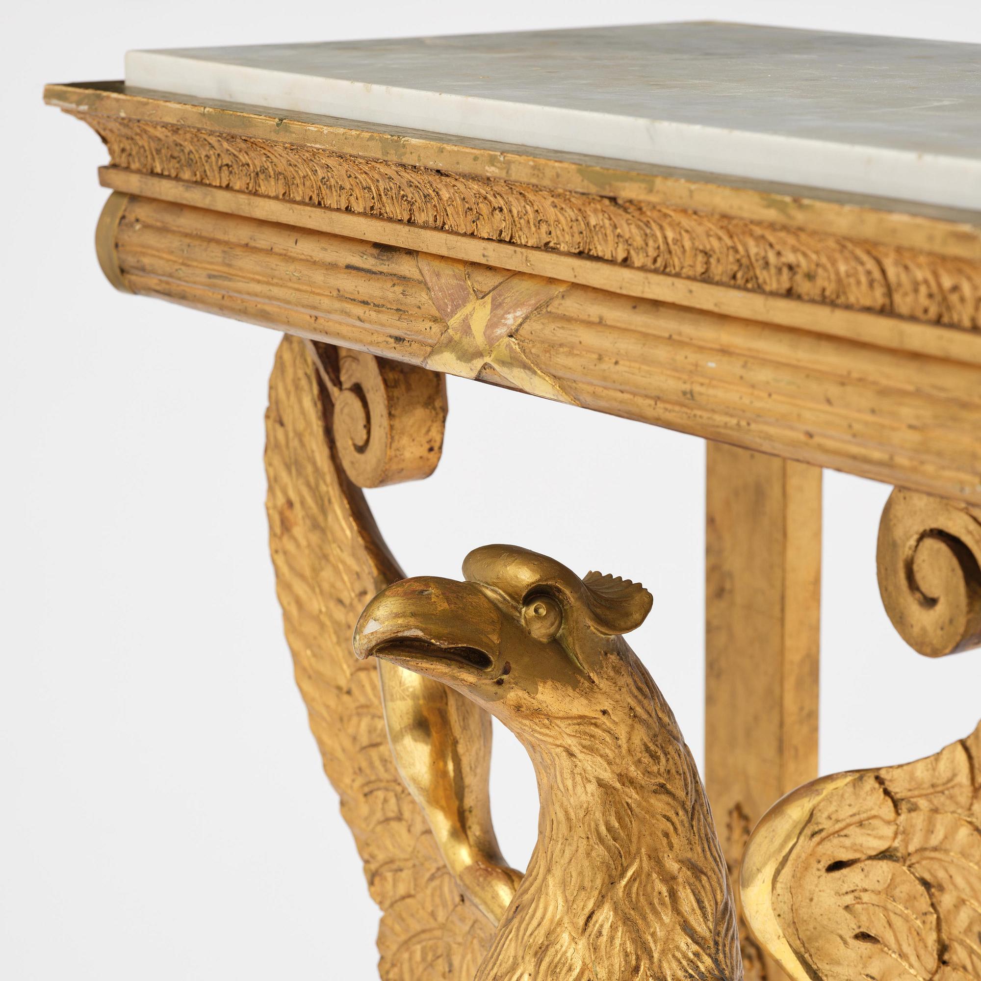 A Swedish Empire giltwood console table, early 19th century.