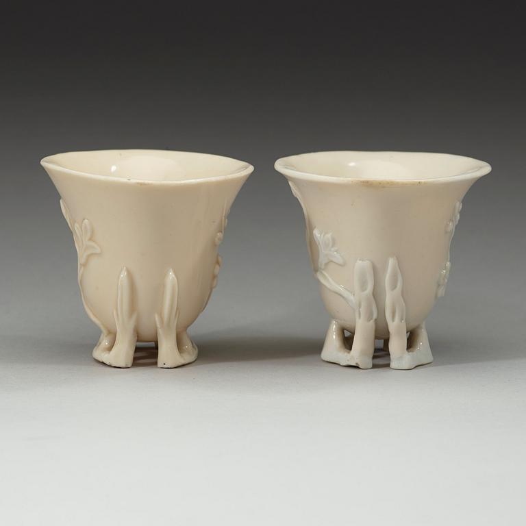 A pair of blanc de chine libation cups, Qing dynasty 18th century.