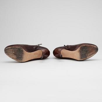 CHRISTIAN DIOR, a pair of brown leather boots.