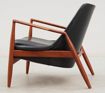 An Ib Kofod Larsen black leather and teak easy chair 'The Seal' by OPE, Sweden 1950-60's.