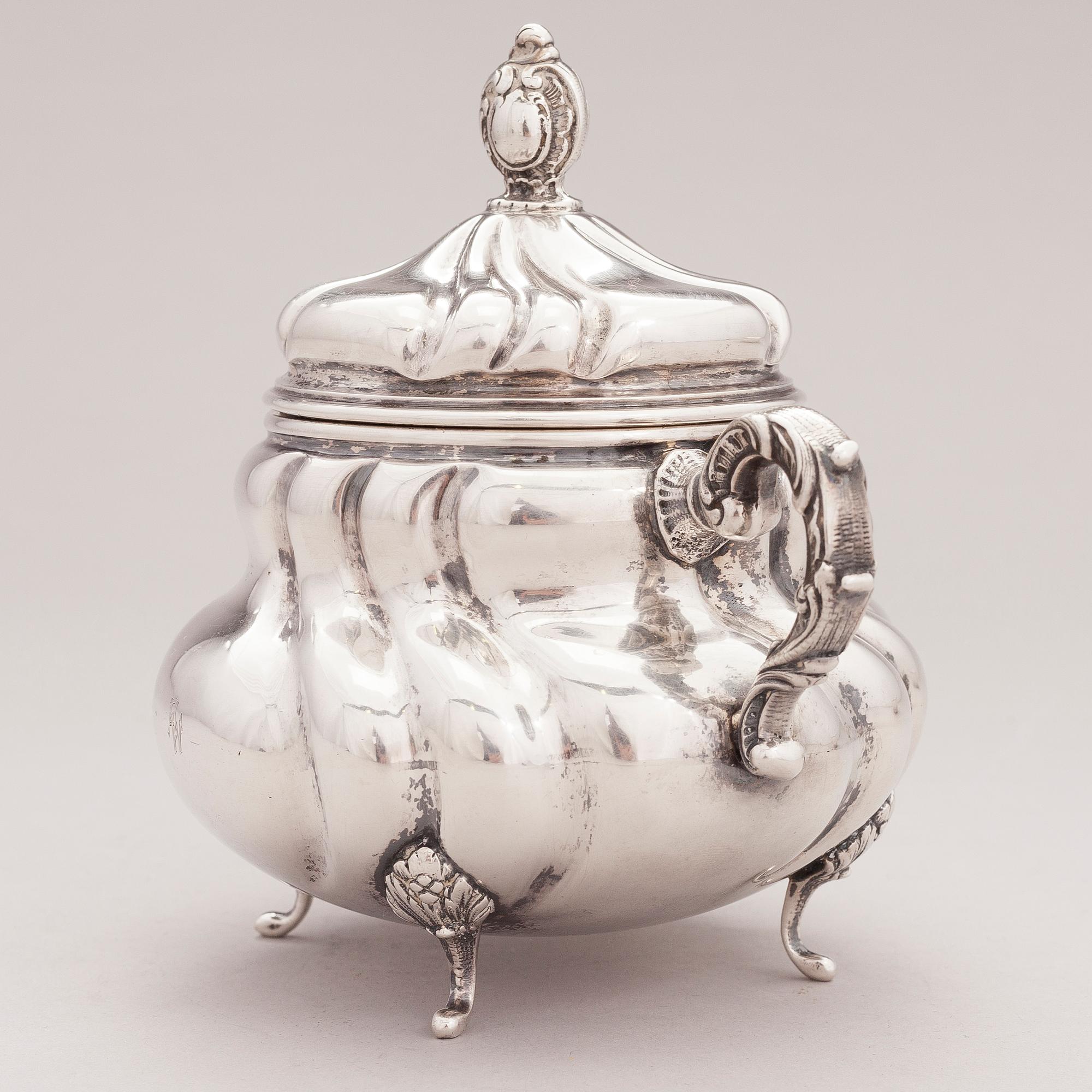 A lidded silver sugar bowl and a set of six silver bowls, Germany.