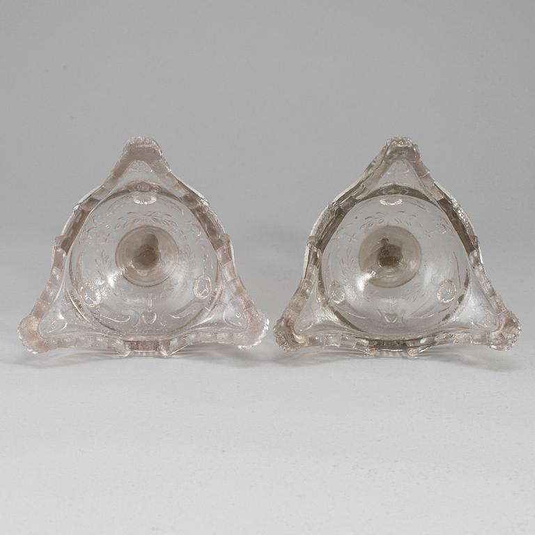 A pair of moulded glass candlesticks, late 19th century.