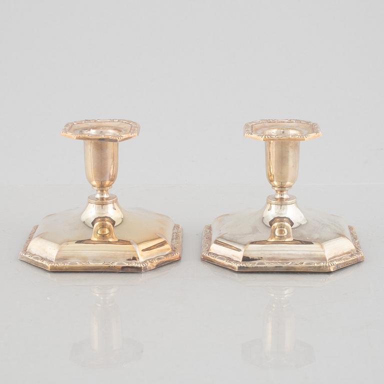 Two pairs of silver candlesticks, including Eric Löfman, MEMA, Lidköping 1994.