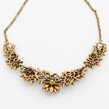 Necklace and brooch with purple stones.