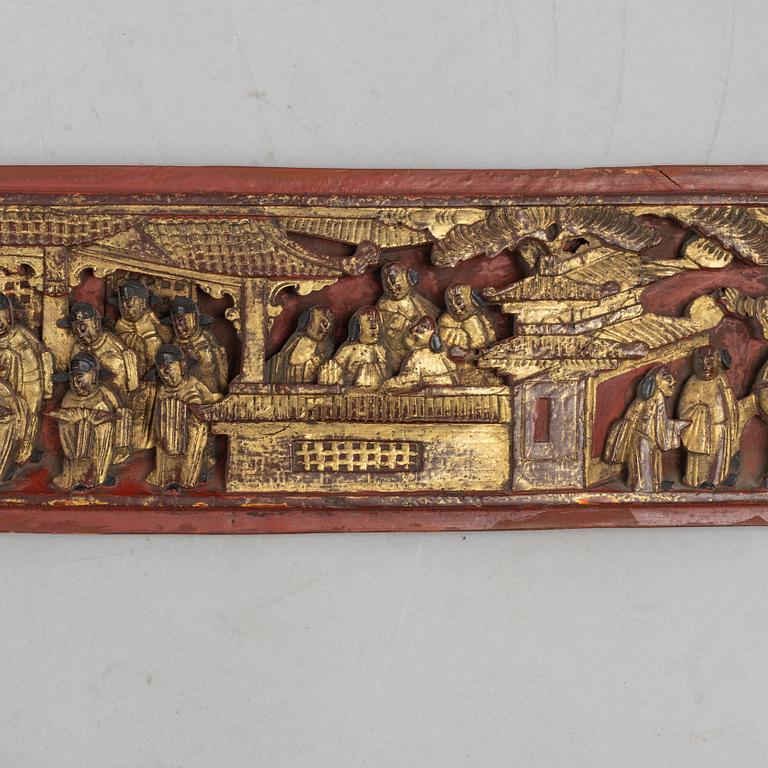 A group of three Chinese wooden panels, late Qing dynasty / around 1900.