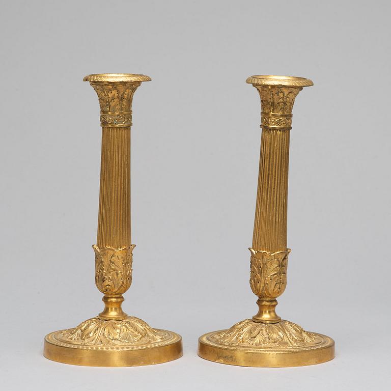 A pair of French Empire-style late 19th ct candlesticks.