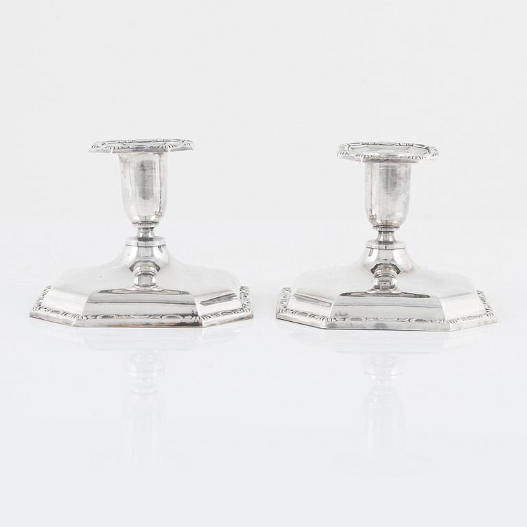 A Swedish Silver Ladle, mark of Adolf Öström, Piteå 1887 and a pair of Silver Candlesticks.