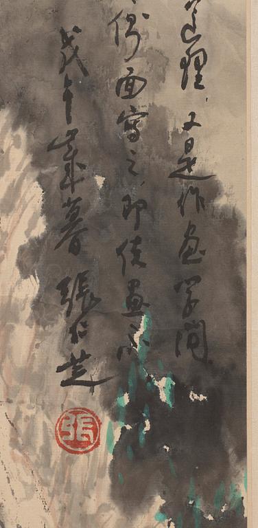 Zhang Renzhi, A hanging scroll of a rocky landscape with a river valley and house, signed.