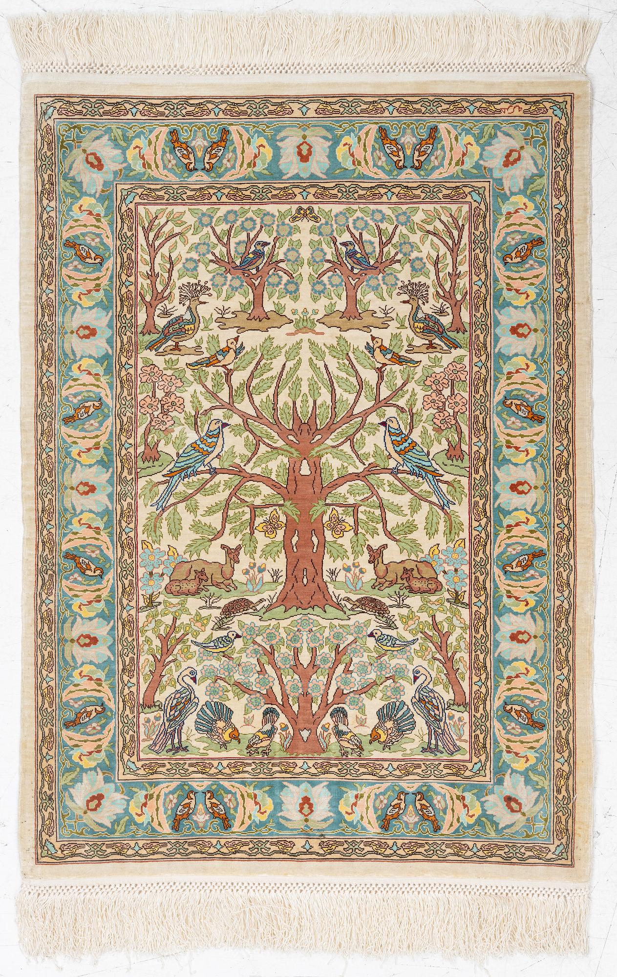 A figural silk Hereke rug, c 65 x 47 cm.