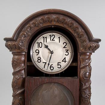 An early 20th century art nouveau grandfather clock.