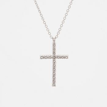 Brilliant-cut diamond cross pendant.