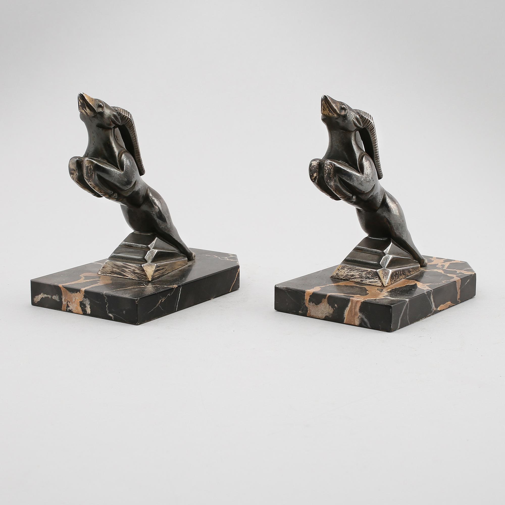 BOKSTÖD, 1 par, patinerad metall, signerade H Moreau, 1900-talets första hälft.