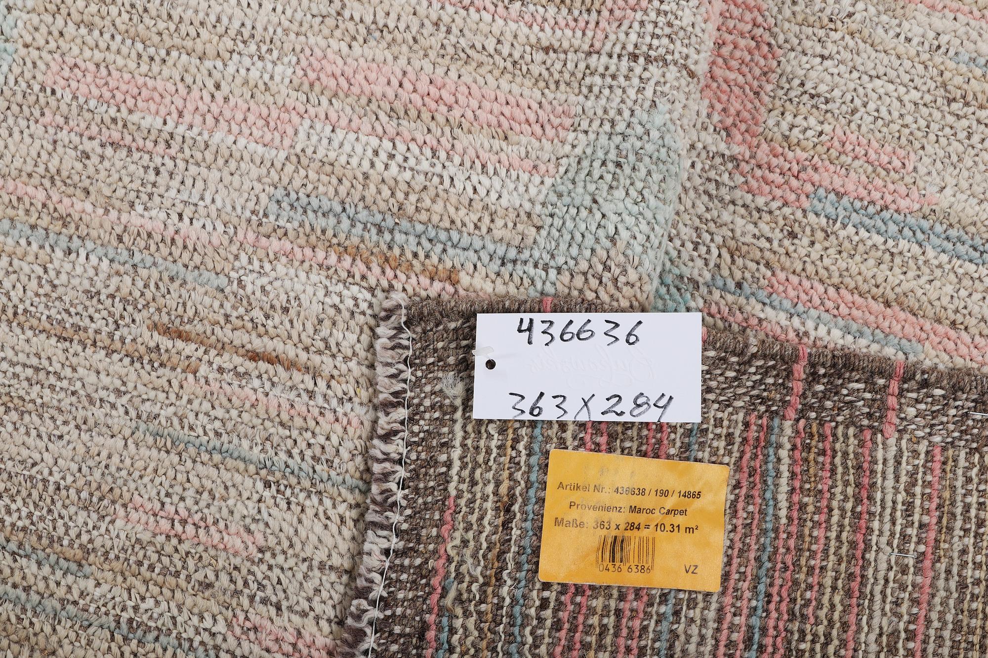 A Moroccan carpet, c. 363 x 284 cm.