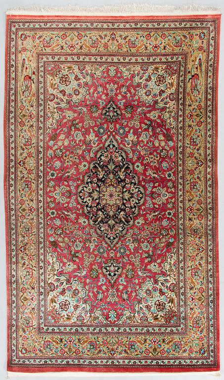 A silk Qum rug, central Persia, approx. 232 x 137 cm.
