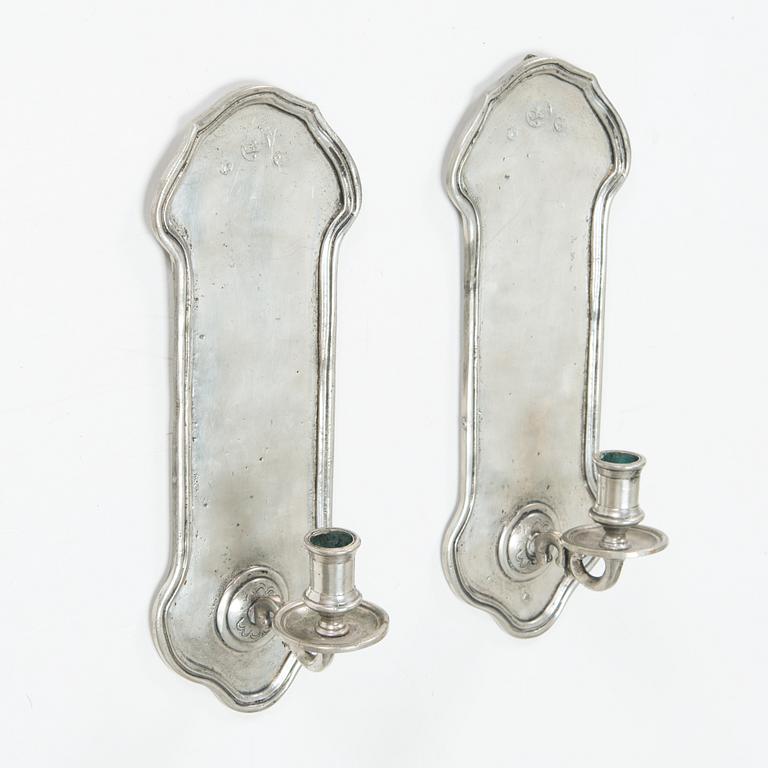 A pair of 1920s-30s tin sconces.