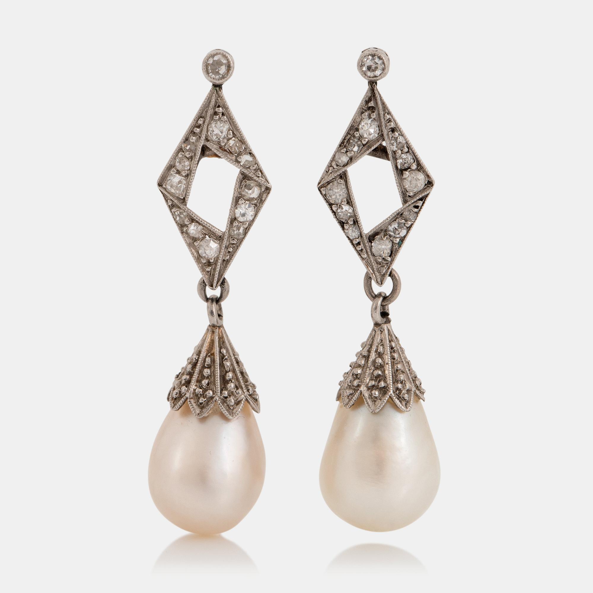 A pair of platinum and natural pearl earrings.