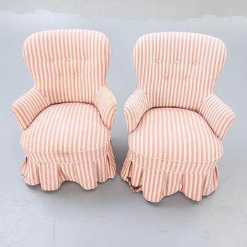 A pair of Modern easy chairs.
